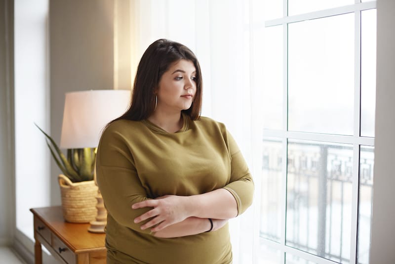 A married woman is reflecting about her sudden weight gain after marriage