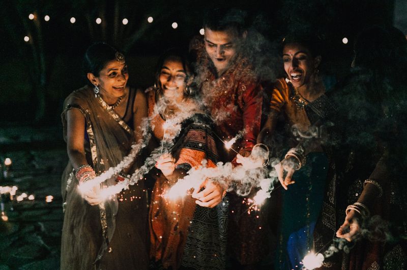 A young married couple is celebrating Diwali with the wife's family